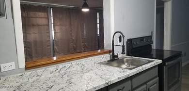 Welcome to your renovated, 3 bedroom, 1 bath house located on Riviera Country Club in Florida - for sale on GolfHomes.com, golf home, golf lot