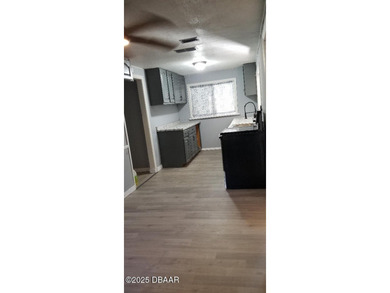 Welcome to your renovated, 3 bedroom, 1 bath house located on Riviera Country Club in Florida - for sale on GolfHomes.com, golf home, golf lot