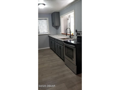 Welcome to your renovated, 3 bedroom, 1 bath house located on Riviera Country Club in Florida - for sale on GolfHomes.com, golf home, golf lot