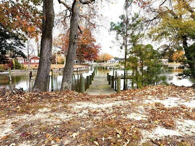 Welcome to Tee & Tide, a waterfront retreat where your days on Indian Creek Yacht and Country Club in Virginia - for sale on GolfHomes.com, golf home, golf lot