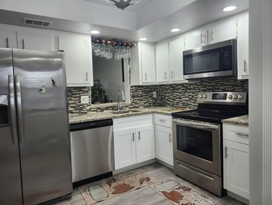 WOW!!! RARELY AVAILABLE REMODLED GROUND FLOOR CORNER UNIT on  in Florida - for sale on GolfHomes.com, golf home, golf lot