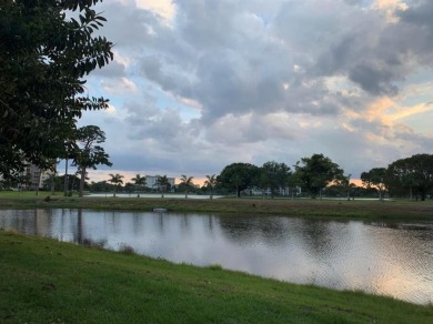 Specious 2 bed 2 bath ground floor unit with beautiful lake view on Palm-Aire Country Club and Resort - Palms in Florida - for sale on GolfHomes.com, golf home, golf lot