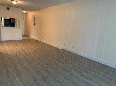 Specious 2 bed 2 bath ground floor unit with beautiful lake view on Palm-Aire Country Club and Resort - Palms in Florida - for sale on GolfHomes.com, golf home, golf lot