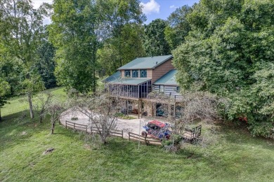 The essence of Tennessee Living! Honest Abe Log Home perched on on Hidden Valley Golf and Country Club in Tennessee - for sale on GolfHomes.com, golf home, golf lot