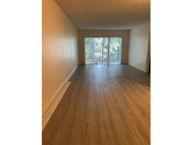 Specious 2 bed 2 bath ground floor unit with beautiful lake view on Palm-Aire Country Club and Resort - Palms in Florida - for sale on GolfHomes.com, golf home, golf lot