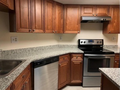 Specious 2 bed 2 bath ground floor unit with beautiful lake view on Palm-Aire Country Club and Resort - Palms in Florida - for sale on GolfHomes.com, golf home, golf lot