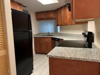 Specious 2 bed 2 bath ground floor unit with beautiful lake view on Palm-Aire Country Club and Resort - Palms in Florida - for sale on GolfHomes.com, golf home, golf lot