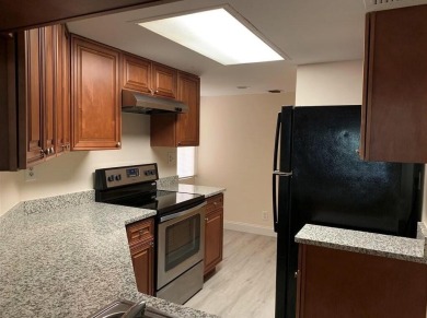 Specious 2 bed 2 bath ground floor unit with beautiful lake view on Palm-Aire Country Club and Resort - Palms in Florida - for sale on GolfHomes.com, golf home, golf lot