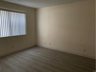 Specious 2 bed 2 bath ground floor unit with beautiful lake view on Palm-Aire Country Club and Resort - Palms in Florida - for sale on GolfHomes.com, golf home, golf lot