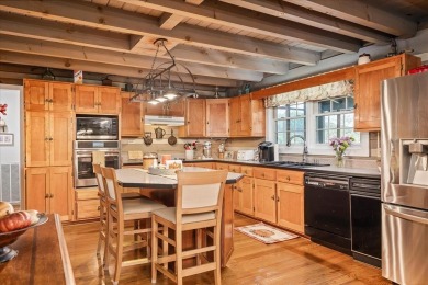 The essence of Tennessee Living! Honest Abe Log Home perched on on Hidden Valley Golf and Country Club in Tennessee - for sale on GolfHomes.com, golf home, golf lot