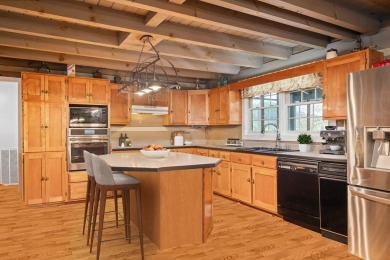 The essence of Tennessee Living! Honest Abe Log Home perched on on Hidden Valley Golf and Country Club in Tennessee - for sale on GolfHomes.com, golf home, golf lot