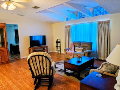 This spacious 3 bdrm,2 bath PALM HARBOR is completely furnished on Southport Springs Golf Club in Florida - for sale on GolfHomes.com, golf home, golf lot