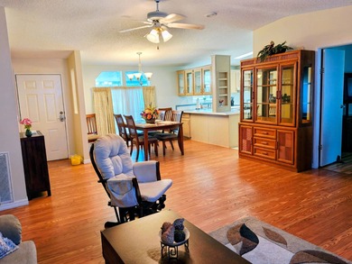 This spacious 3 bdrm,2 bath PALM HARBOR is completely furnished on Southport Springs Golf Club in Florida - for sale on GolfHomes.com, golf home, golf lot