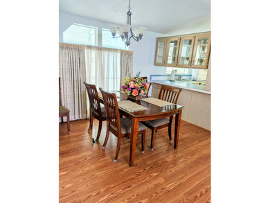 This spacious 3 bdrm,2 bath PALM HARBOR is completely furnished on Southport Springs Golf Club in Florida - for sale on GolfHomes.com, golf home, golf lot