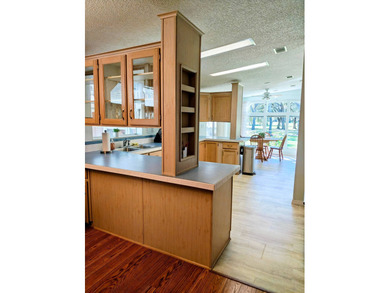 This spacious 3 bdrm,2 bath PALM HARBOR is completely furnished on Southport Springs Golf Club in Florida - for sale on GolfHomes.com, golf home, golf lot