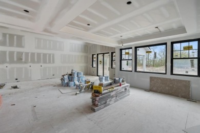Experience elevated living at 809 Fairways Drive, located in The on Birchwood Farms Golf and Country Club in Michigan - for sale on GolfHomes.com, golf home, golf lot