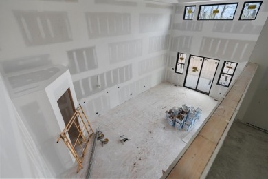 Experience elevated living at 809 Fairways Drive, located in The on Birchwood Farms Golf and Country Club in Michigan - for sale on GolfHomes.com, golf home, golf lot