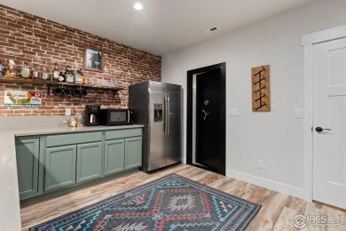 This beautifully designed home features vaulted ceilings, rich on Eaton Country Club in Colorado - for sale on GolfHomes.com, golf home, golf lot