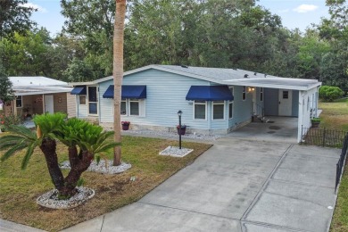 Nestled against a tranquil wooded backdrop, this beautifully on El Diablo Executive Golf Course in Florida - for sale on GolfHomes.com, golf home, golf lot
