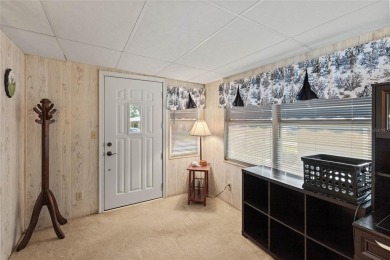 Nestled against a tranquil wooded backdrop, this beautifully on El Diablo Executive Golf Course in Florida - for sale on GolfHomes.com, golf home, golf lot