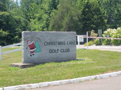 Nestled on a sprawling 1.53-acre lot in the prestigious on Christmas Lake Golf Course in Indiana - for sale on GolfHomes.com, golf home, golf lot