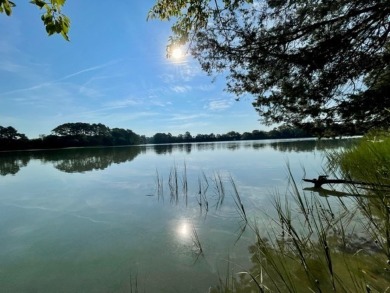 This is a tranquil waterfront homesite, with sunrise views on Bay Creek Golf Club in Virginia - for sale on GolfHomes.com, golf home, golf lot