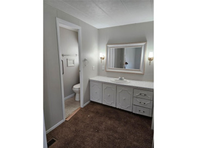 This home is seeking someone to complete the repairs and restore on Pelican Pointe Golf and Country Club in Florida - for sale on GolfHomes.com, golf home, golf lot