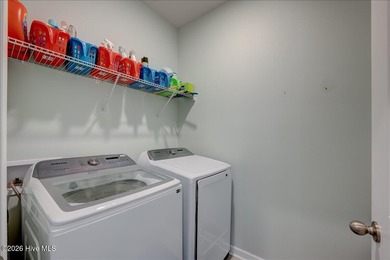 Welcome to 2021 Caracara Drive, located in the gated Fairfield on Harbour Point Golf Club in North Carolina - for sale on GolfHomes.com, golf home, golf lot