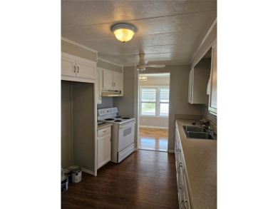 This home is seeking someone to complete the repairs and restore on Pelican Pointe Golf and Country Club in Florida - for sale on GolfHomes.com, golf home, golf lot