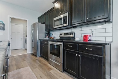 Nestled beside Stone Canyon Golf Course, this immaculate on Stone Canyon Golf Club in Missouri - for sale on GolfHomes.com, golf home, golf lot