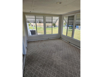 This home is seeking someone to complete the repairs and restore on Pelican Pointe Golf and Country Club in Florida - for sale on GolfHomes.com, golf home, golf lot