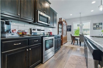 Nestled beside Stone Canyon Golf Course, this immaculate on Stone Canyon Golf Club in Missouri - for sale on GolfHomes.com, golf home, golf lot