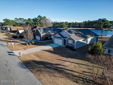 Welcome to 2021 Caracara Drive, located in the gated Fairfield on Harbour Point Golf Club in North Carolina - for sale on GolfHomes.com, golf home, golf lot