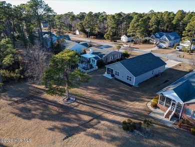 Welcome to 2021 Caracara Drive, located in the gated Fairfield on Harbour Point Golf Club in North Carolina - for sale on GolfHomes.com, golf home, golf lot