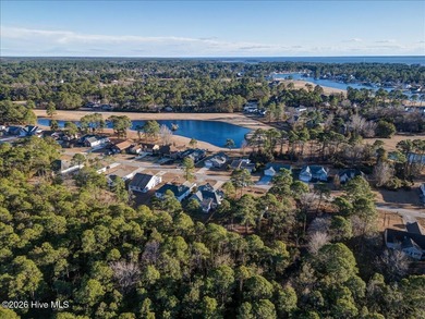 Welcome to 2021 Caracara Drive, located in the gated Fairfield on Harbour Point Golf Club in North Carolina - for sale on GolfHomes.com, golf home, golf lot