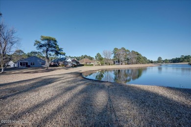 Welcome to 2021 Caracara Drive, located in the gated Fairfield on Harbour Point Golf Club in North Carolina - for sale on GolfHomes.com, golf home, golf lot