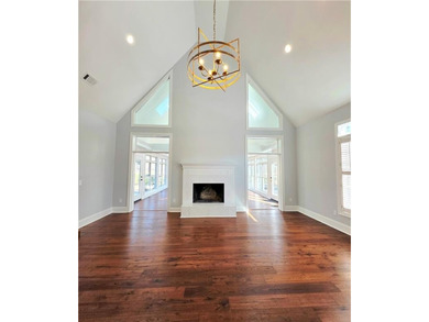 Perfectly positioned on the 18th tee box of the prestigious on Okefenokee Country Club in Georgia - for sale on GolfHomes.com, golf home, golf lot