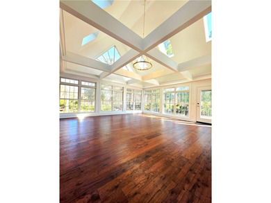 Perfectly positioned on the 18th tee box of the prestigious on Okefenokee Country Club in Georgia - for sale on GolfHomes.com, golf home, golf lot