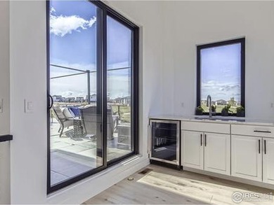 Welcome to elevated Colorado living at its finest. Perched above on Raindance National Golf Course in Colorado - for sale on GolfHomes.com, golf home, golf lot