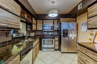 VERY WELL KEPT CONDO LARGER THAN THE TAX ROLLS WITH A RENOVATED on The Diplomat Golf Resort and Spa in Florida - for sale on GolfHomes.com, golf home, golf lot