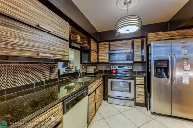 VERY WELL KEPT CONDO LARGER THAN THE TAX ROLLS WITH A RENOVATED on The Diplomat Golf Resort and Spa in Florida - for sale on GolfHomes.com, golf home, golf lot