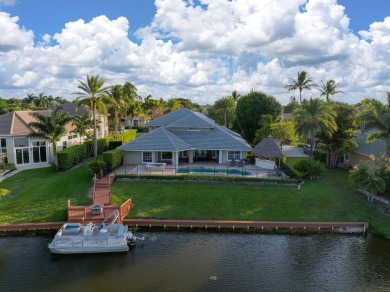 Enjoy lakefront sunsets from this elegant home in the gated on Greenview Cove Golf Club in Florida - for sale on GolfHomes.com, golf home, golf lot