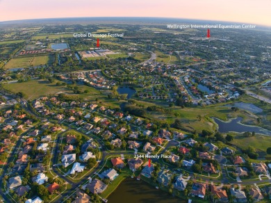 Enjoy lakefront sunsets from this elegant home in the gated on Greenview Cove Golf Club in Florida - for sale on GolfHomes.com, golf home, golf lot