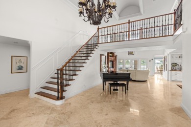Enjoy lakefront sunsets from this elegant home in the gated on Greenview Cove Golf Club in Florida - for sale on GolfHomes.com, golf home, golf lot