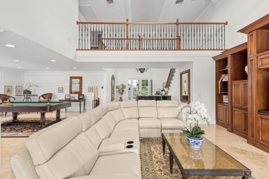 Enjoy lakefront sunsets from this elegant home in the gated on Greenview Cove Golf Club in Florida - for sale on GolfHomes.com, golf home, golf lot