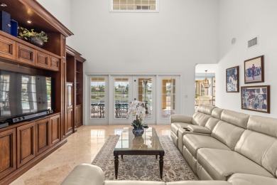 Enjoy lakefront sunsets from this elegant home in the gated on Greenview Cove Golf Club in Florida - for sale on GolfHomes.com, golf home, golf lot