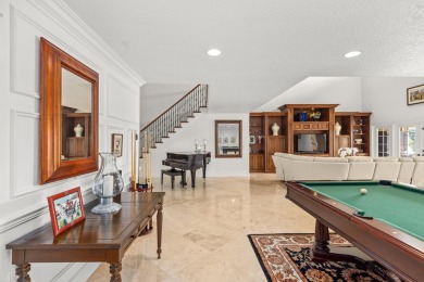 Enjoy lakefront sunsets from this elegant home in the gated on Greenview Cove Golf Club in Florida - for sale on GolfHomes.com, golf home, golf lot