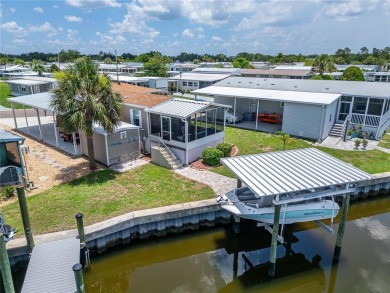 Were you searching for a WATERFRONT HOME with an 8,000 lb BOAT on Apollo Beach Golf and Sea Club in Florida - for sale on GolfHomes.com, golf home, golf lot
