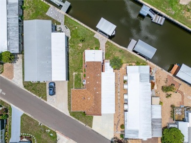 Were you searching for a WATERFRONT HOME with an 8,000 lb BOAT on Apollo Beach Golf and Sea Club in Florida - for sale on GolfHomes.com, golf home, golf lot