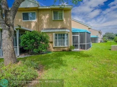 Welcome to this beautiful end unit located on the 5th green of on Woodmont Country Club in Florida - for sale on GolfHomes.com, golf home, golf lot